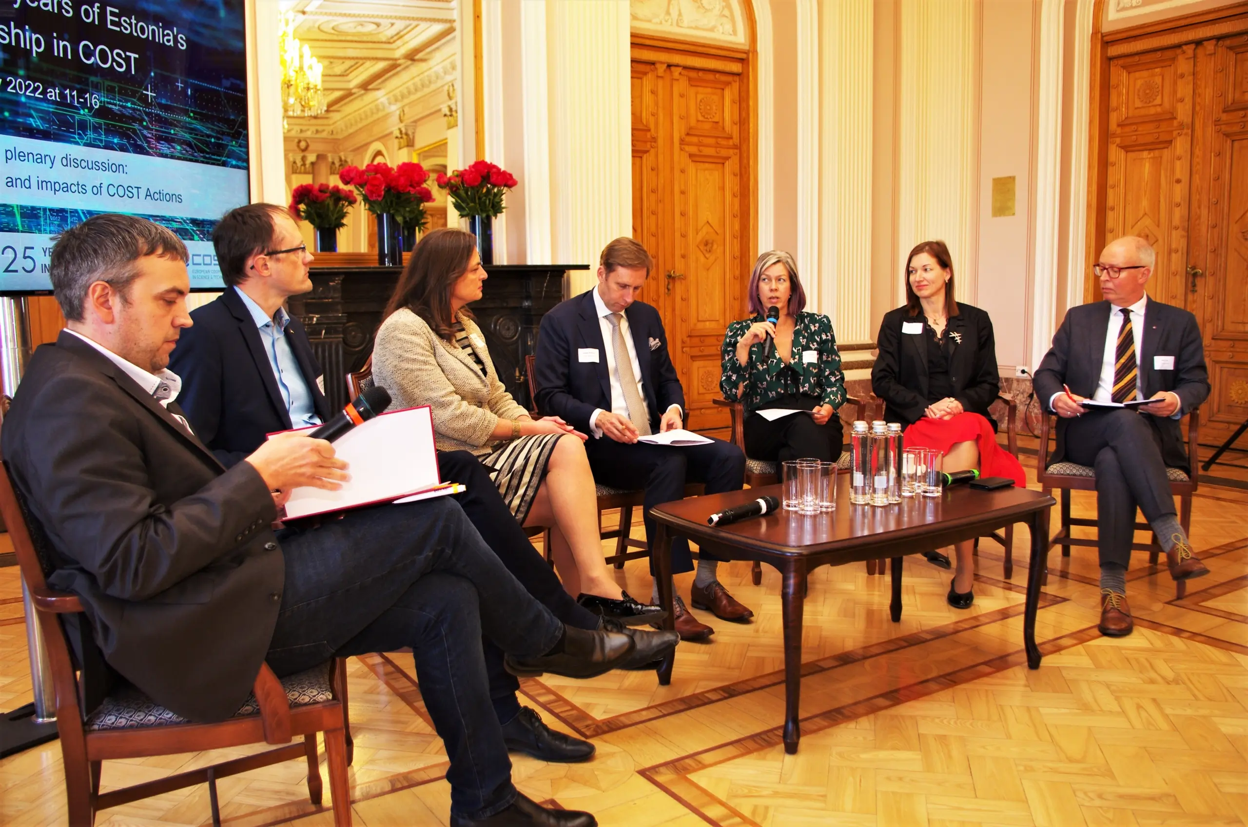 Photo of a 7-person panel discussion inside the Estonian Academy of Sciences