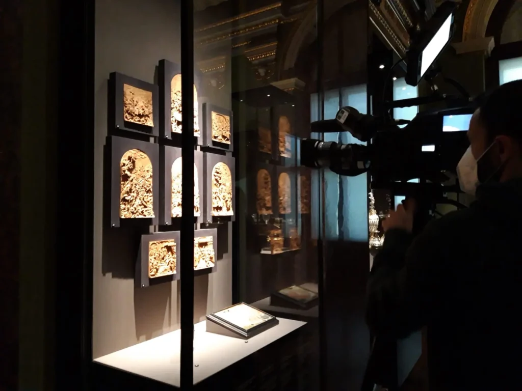 Display cabinet in a museum. Artifacts are illuminated and the space around is very dark.