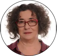 photo of a woman of around 50 years old with curly hair wearing glasses