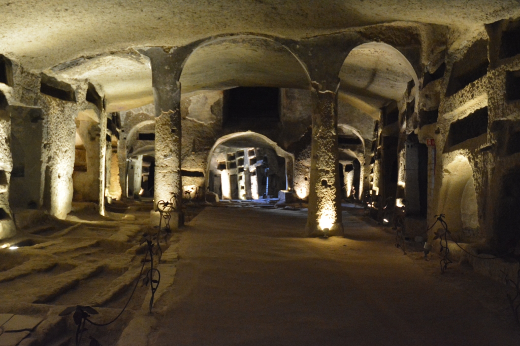 Dark cave with stone columns