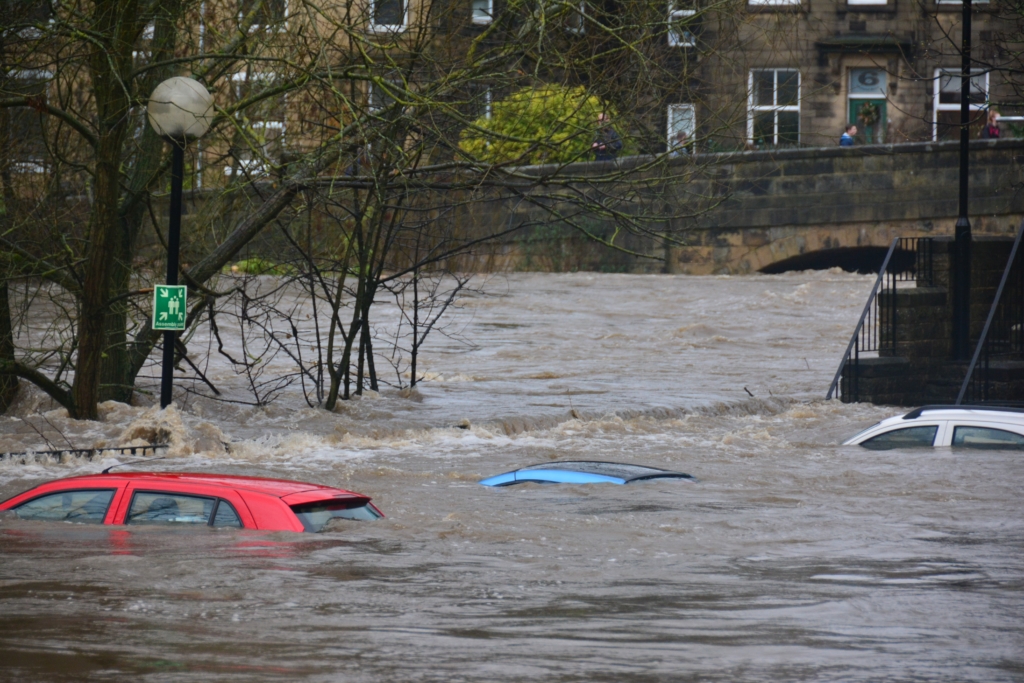 cars in water up to the roof in a city of England