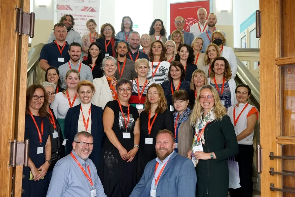 A photo of approximately 30 individuals smiling at the camera.
