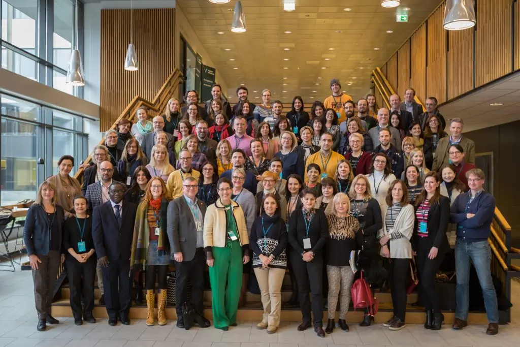 photo of a large group on the stairs