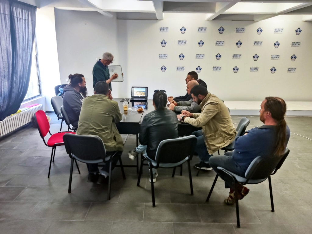 A group of individuals are seated around a table.